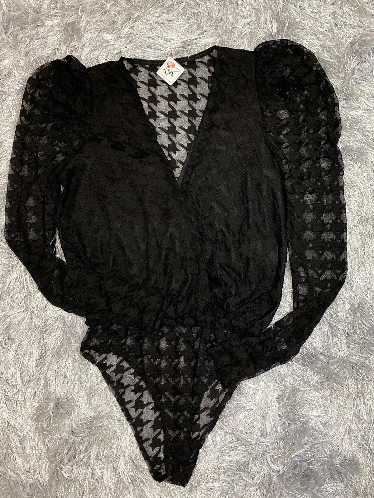 Transparent bodysuit with neckline and long sleeves.